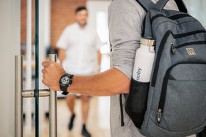 Close-up photo of a Kimoby employee entering the office building