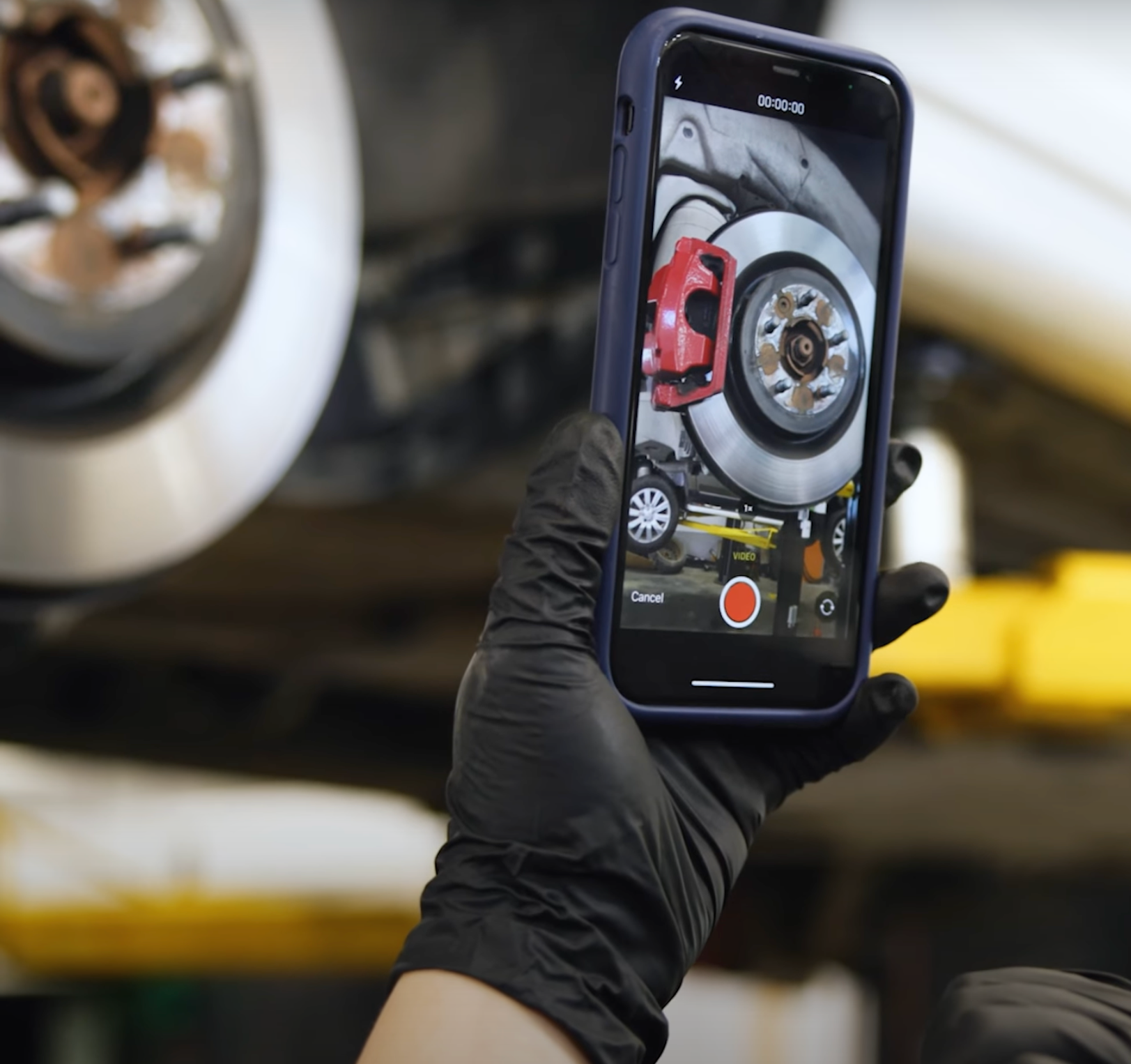 Tech recording video of car repairs