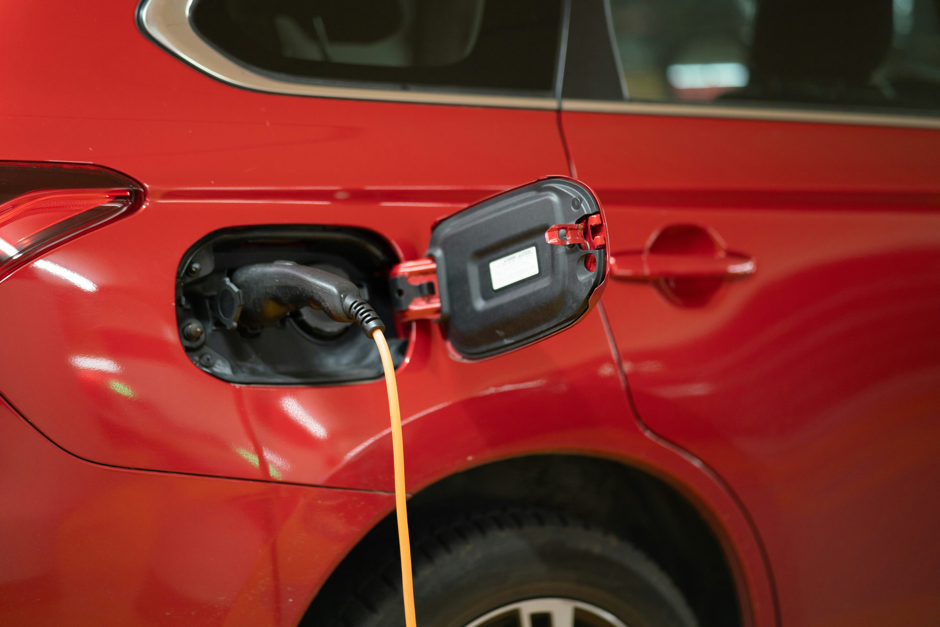 Electric car plugged in for charging.